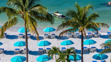 On the beach, white sand, beach towels, kayaking