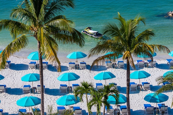 On the beach, white sand, beach towels, kayaking