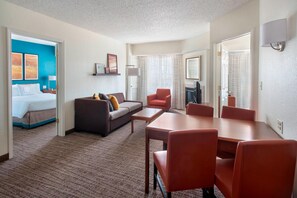 Premium bedding, desk, laptop workspace, blackout drapes