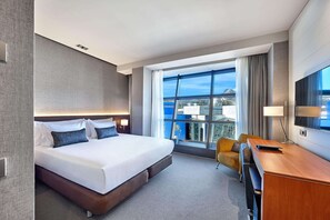 Enjoy a city view from the large window, with a comfortable workspace nearby.