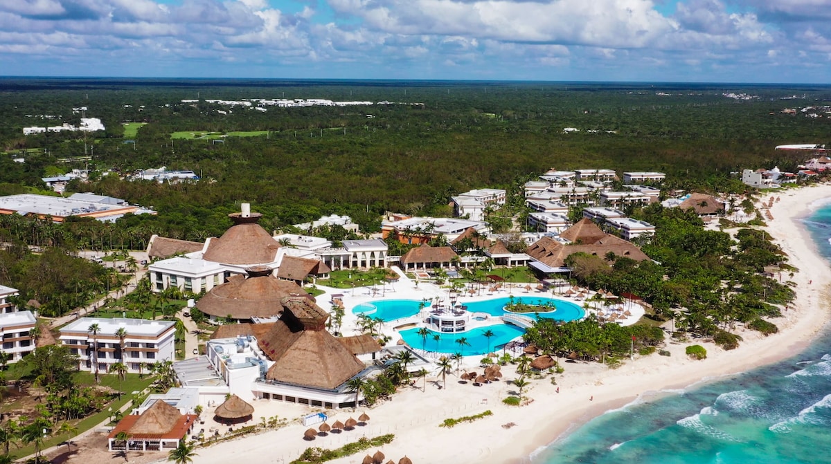aerial shot of Tulum Family resorts, long stretch of beach, three big pools | Tulum Family resorts