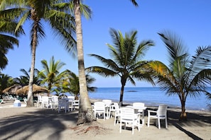 On the beach, sun loungers, beach towels, scuba diving