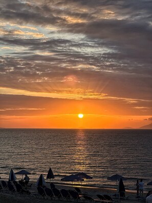 On the beach, sun loungers