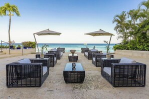 On the beach, white sand, free beach cabanas, sun-loungers
