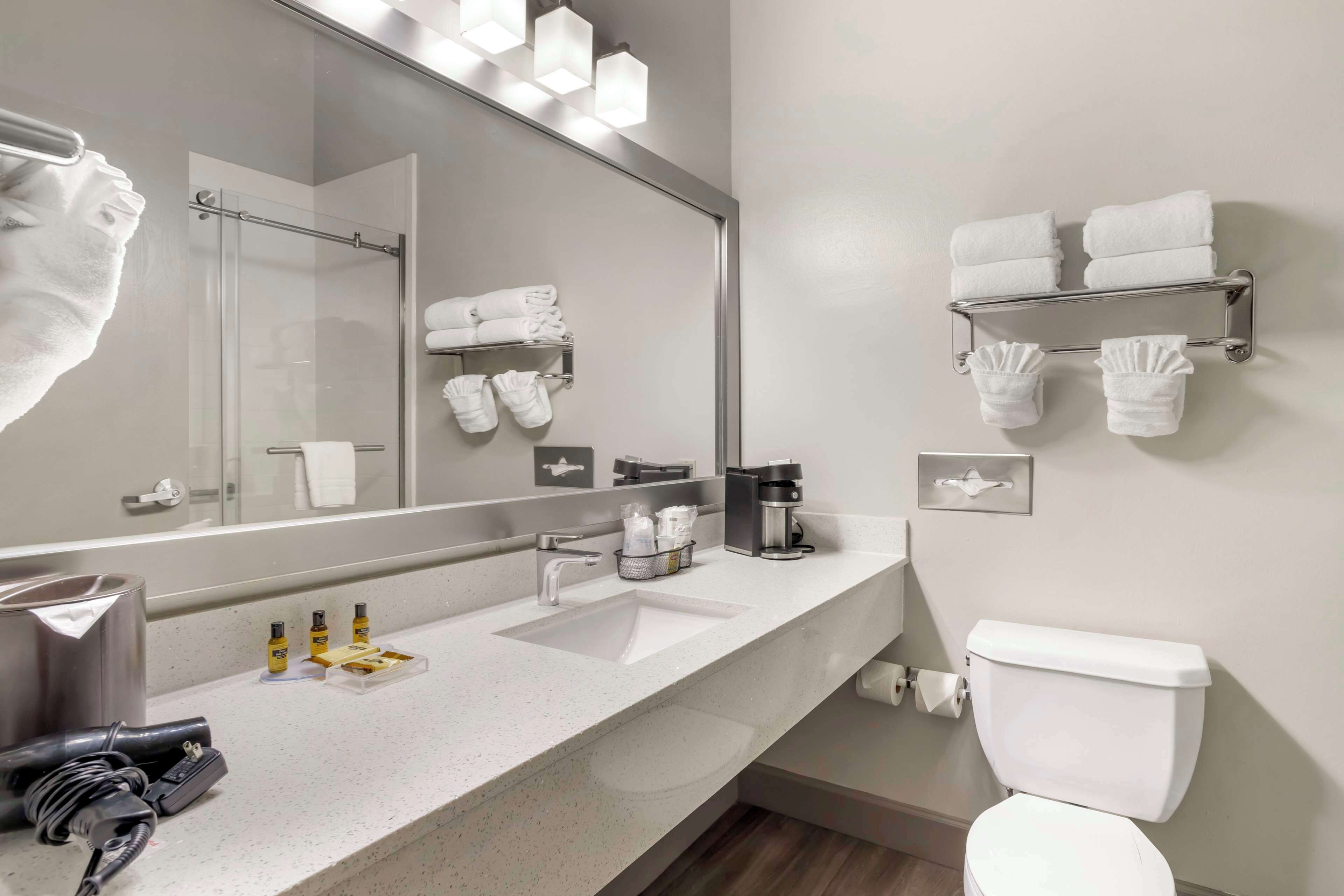 standard room, 2 queen beds, non smoking, refrigerator & microwave | bathroom | free toiletries, hair dryer, towels