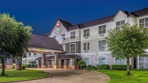 A multi-story hotel with a prominent sign for Best Western PLUS. - Best Western Plus Hobby Airport Inn & Suites (Houston)