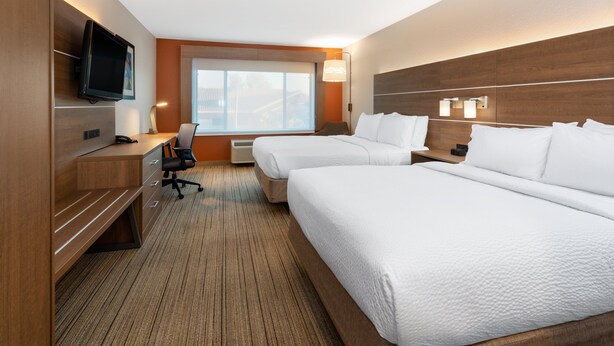 A hotel room with two beds, a desk, a chair, a television, and a window with a view. - Holiday Inn Express & Suites Tucson North – Marana by IHG (Tucson)