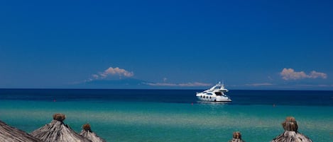 On the beach, sun-loungers, beach umbrellas, scuba diving