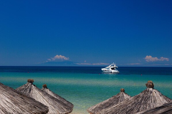 On the beach, sun-loungers, beach umbrellas, scuba diving