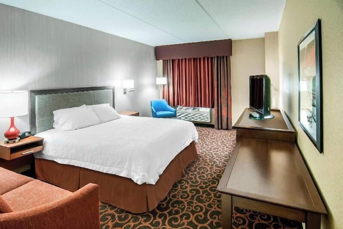 Desk, laptop workspace, blackout drapes, iron/ironing board