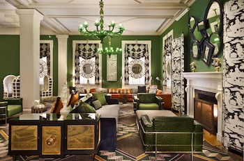 Sitting area in hotel lobby at Kimpton Hotel Monaco Washington DC by IHG