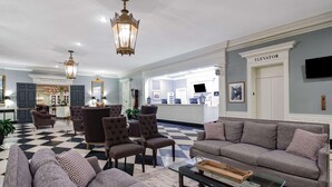 A colonial dining room with a checkered floor, upholstered furniture, and a chandelier. - Natural Bridge Hotel, Trademark Collection by Wyndham (Natural Bridge)