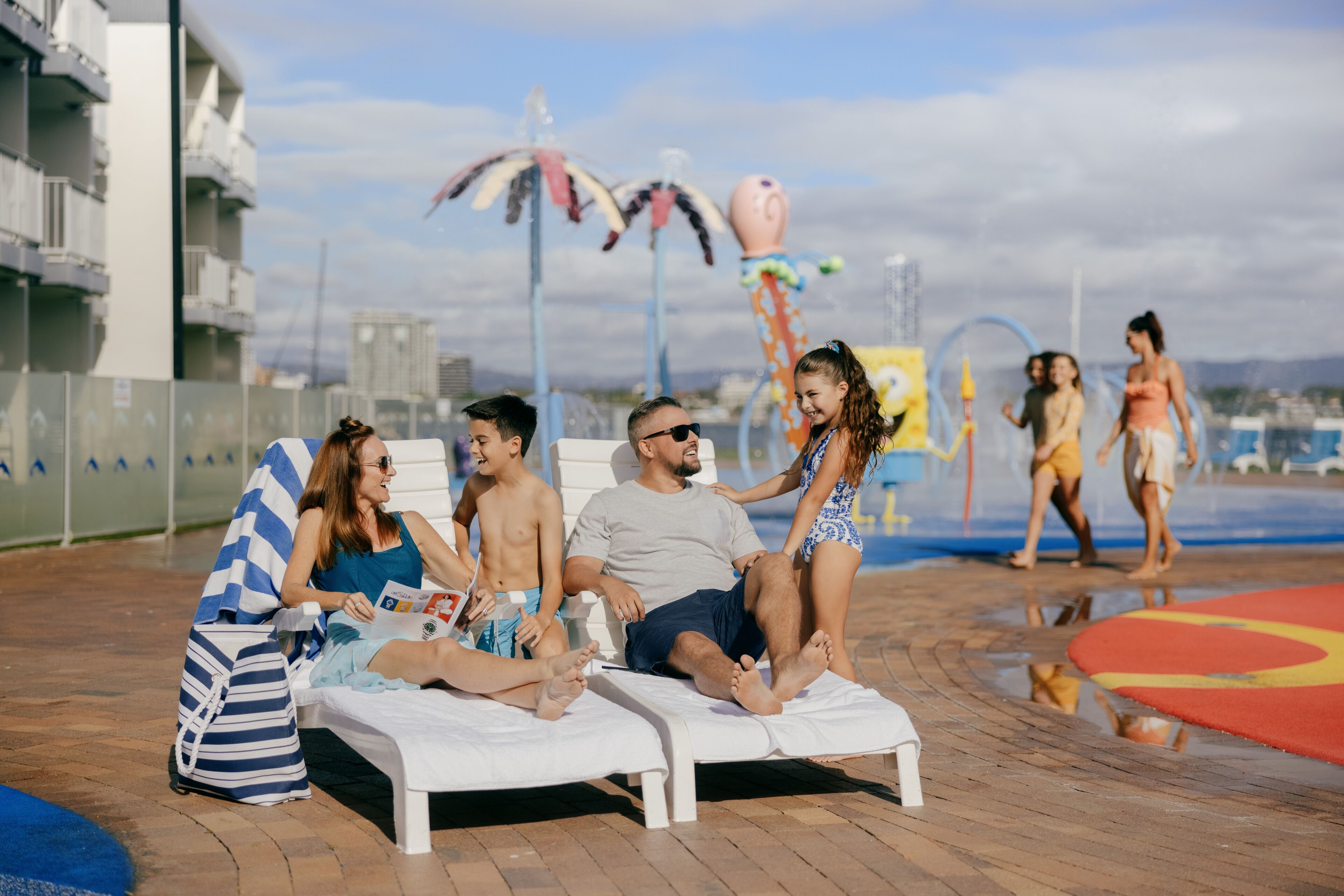 outdoor pool, pool loungers, lifeguards on site