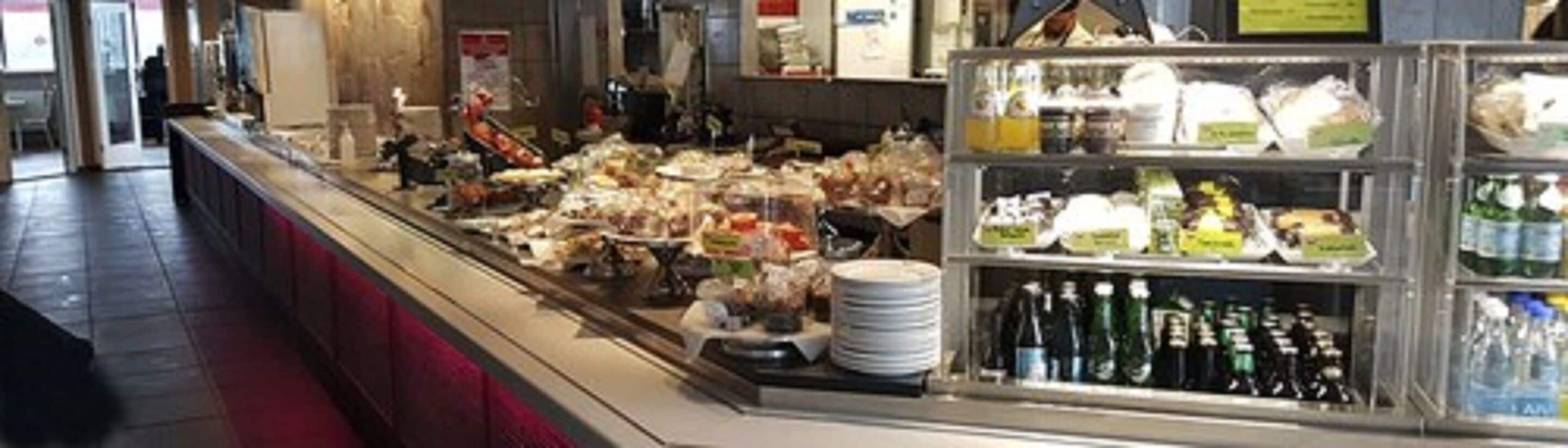 A buffet area with various food items and beverages.