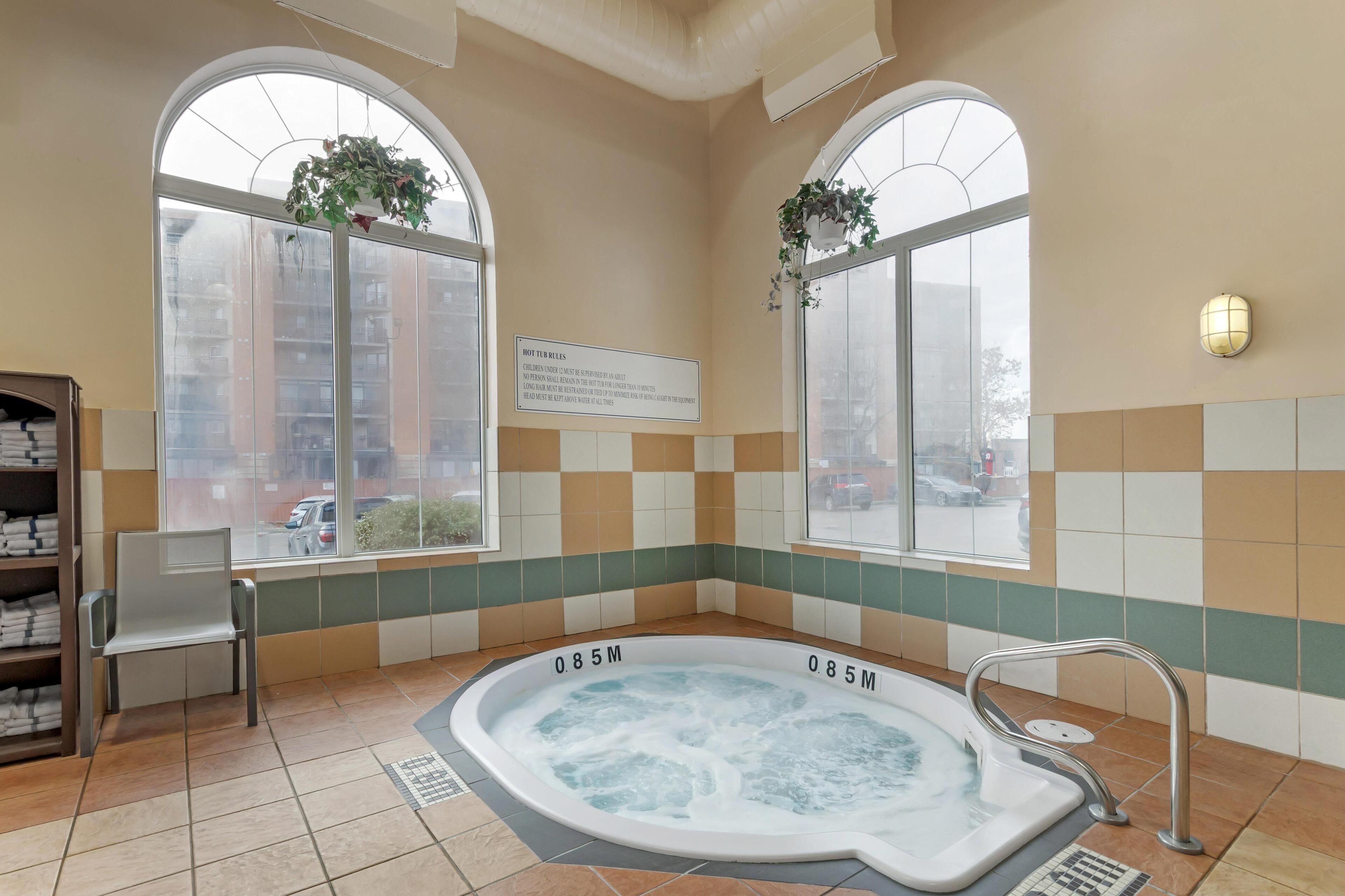 Indoor pool, open 8 AM to 11 PM, pool loungers