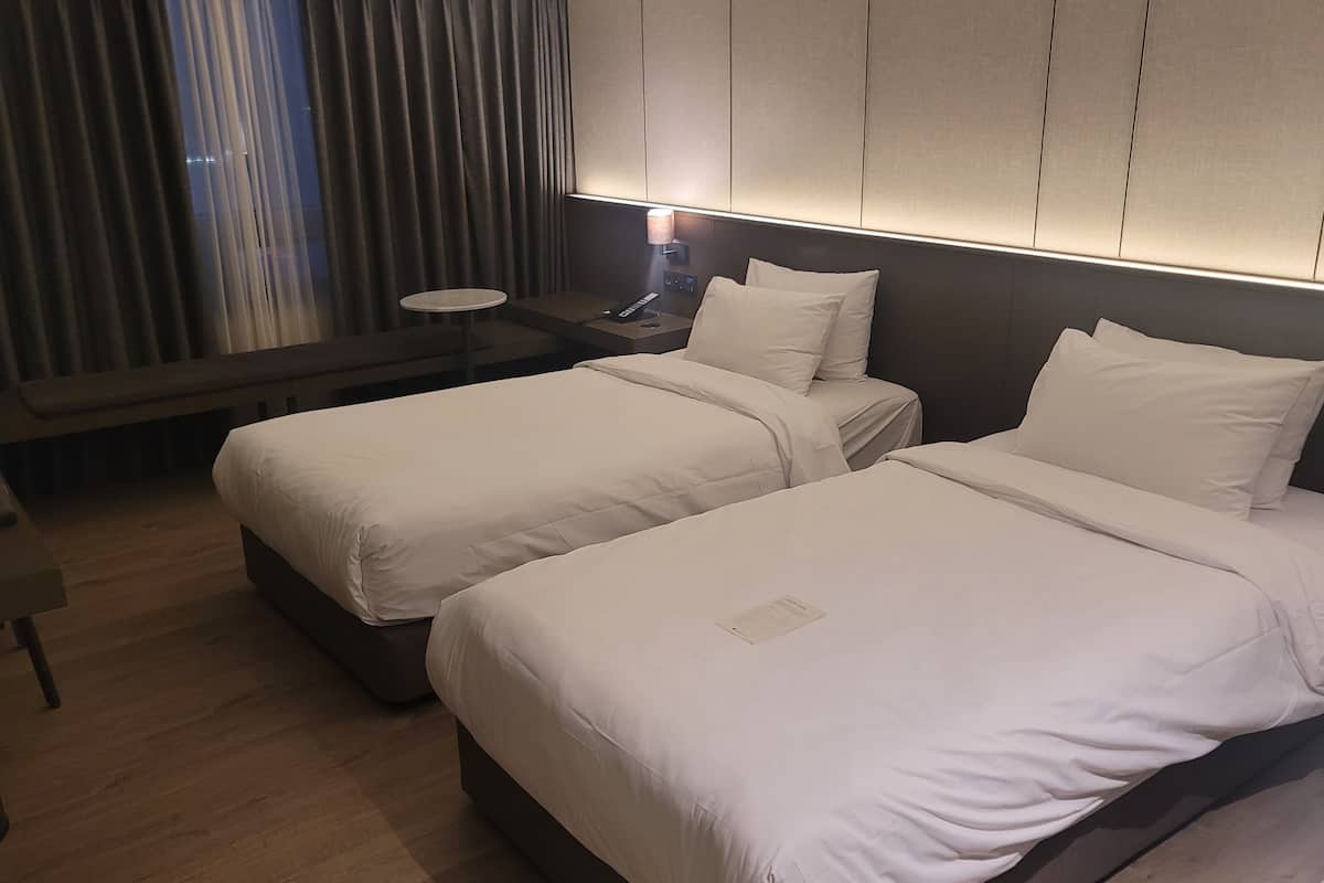 Deluxe Family Twin Room | 1 bedroom, down duvets, individually decorated, desk