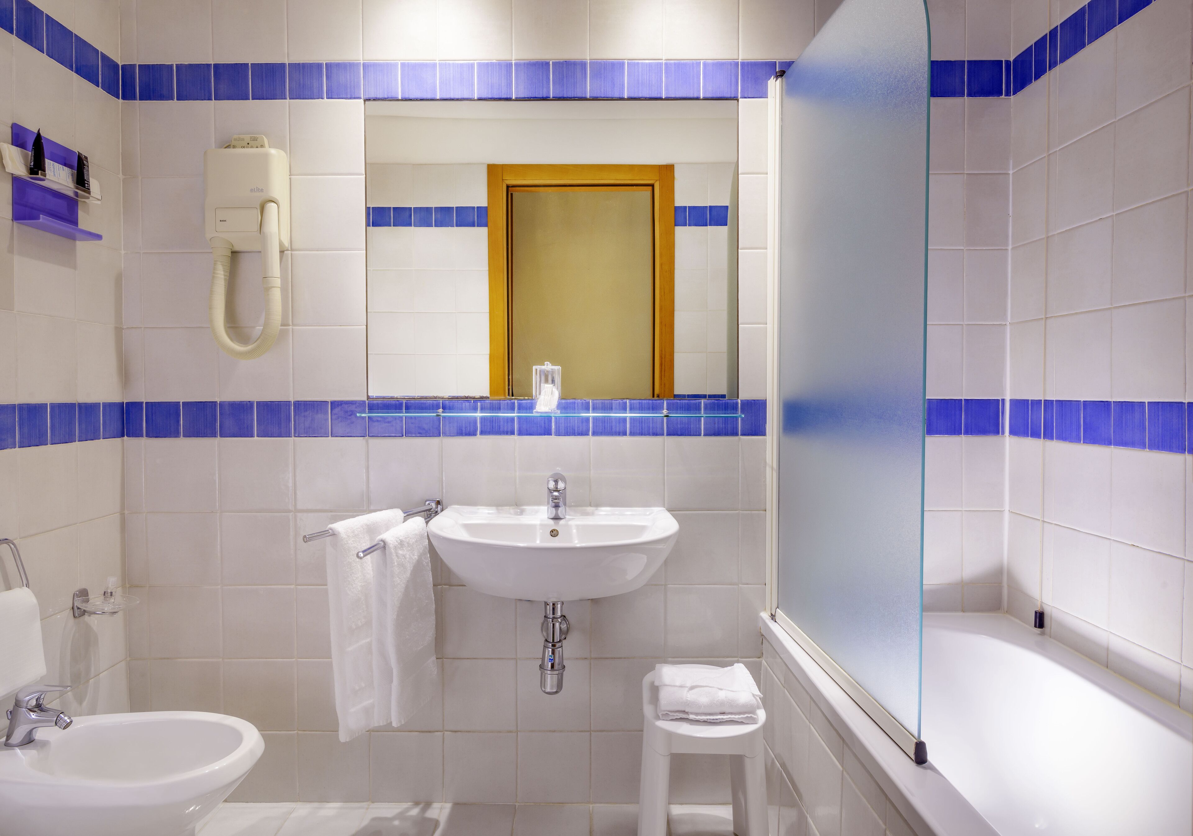 standard single room | bathroom | rainfall showerhead, eco-friendly toiletries, hair dryer, bidet
