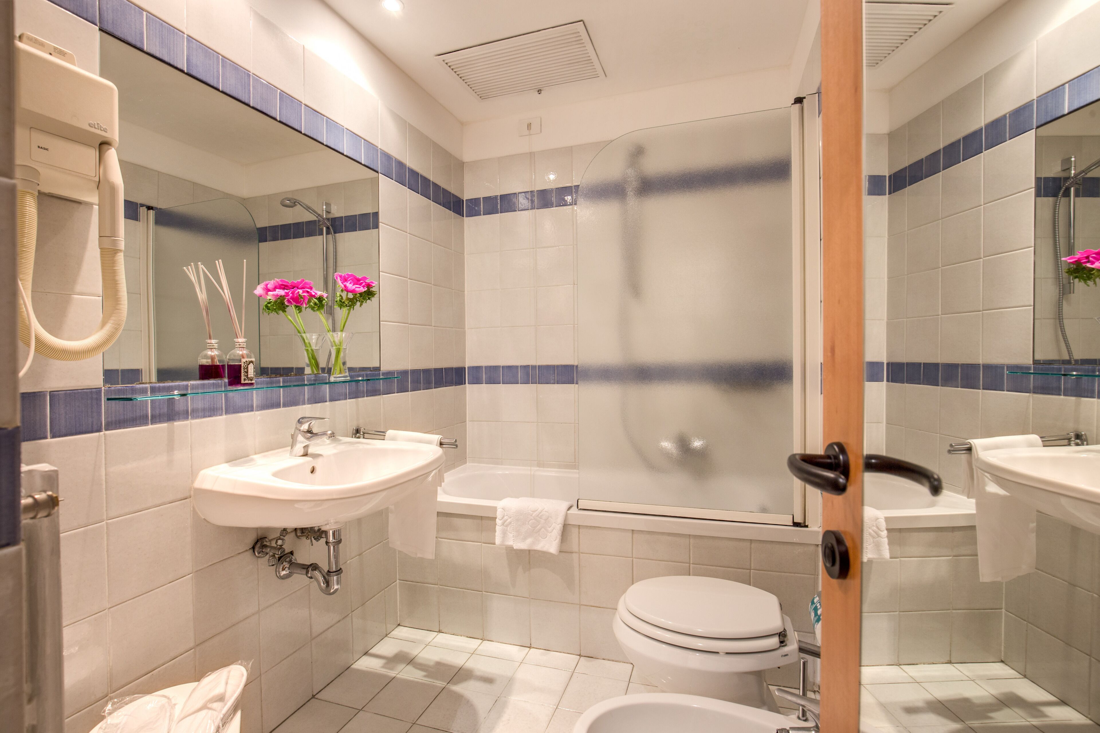 standard double or twin room | bathroom | rainfall showerhead, eco-friendly toiletries, hair dryer, bidet