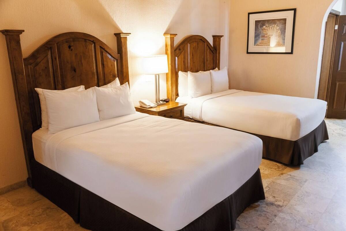 premium condo, 2 bedrooms, hot tub, sea view | 2 bedrooms, in-room safe, iron/ironing board, free cots/infant beds