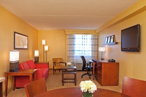 Suite, 1 Bedroom | Living area | 32-inch TV with cable channels