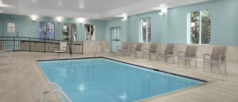 A swimming pool with a tiled deck, a changing room, and a seating area with chairs.