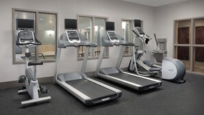 A gym with treadmills, elliptical machines, and a stationary bike. - Holiday Inn Express Hotel & Suites Chambersburg by IHG (Chambersburg)