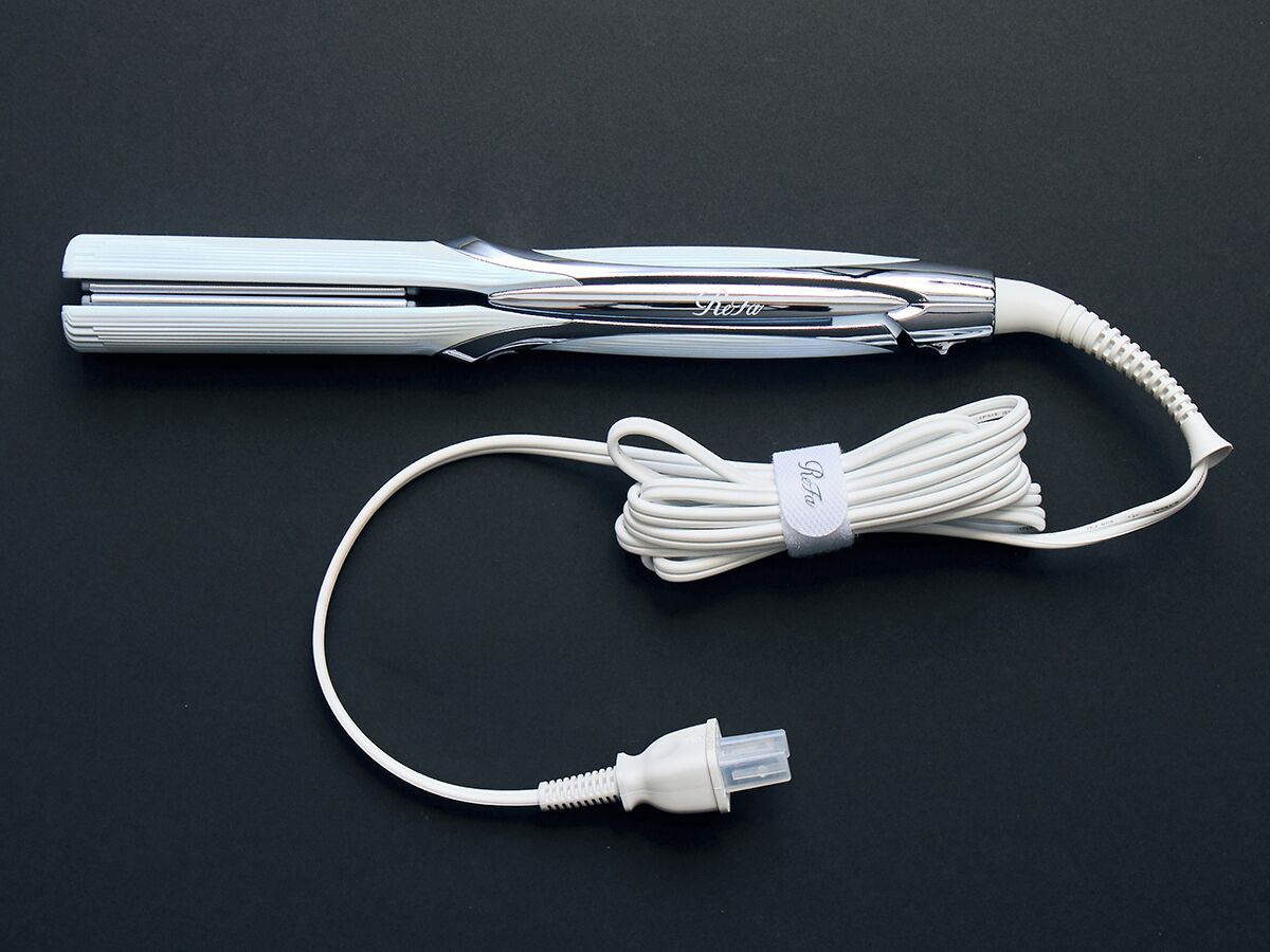 A white cable with a USB connector and a power adapter.