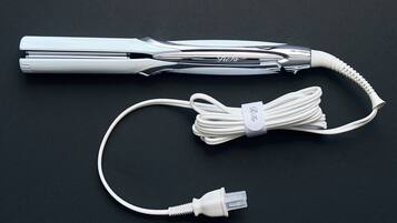 A white cable with a USB connector and a power adapter.