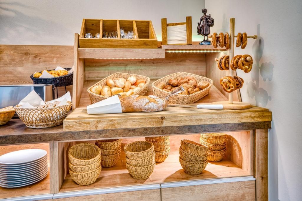 A bakery display with bread, pastries, and baskets.