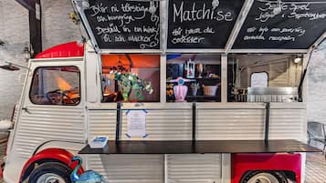 Enjoy a taste of local cuisine from this vintage-style food truck, offering a variety of international dishes.