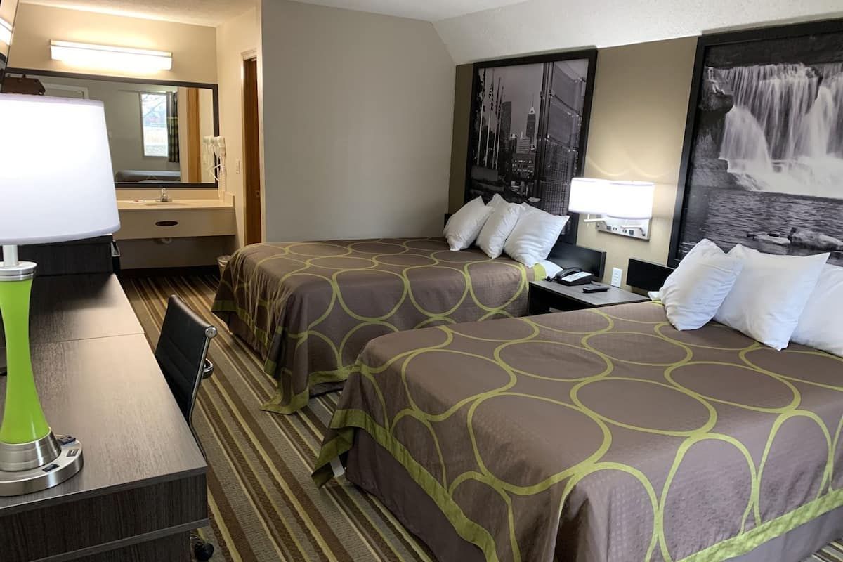 Desk, laptop workspace, blackout drapes, iron/ironing board