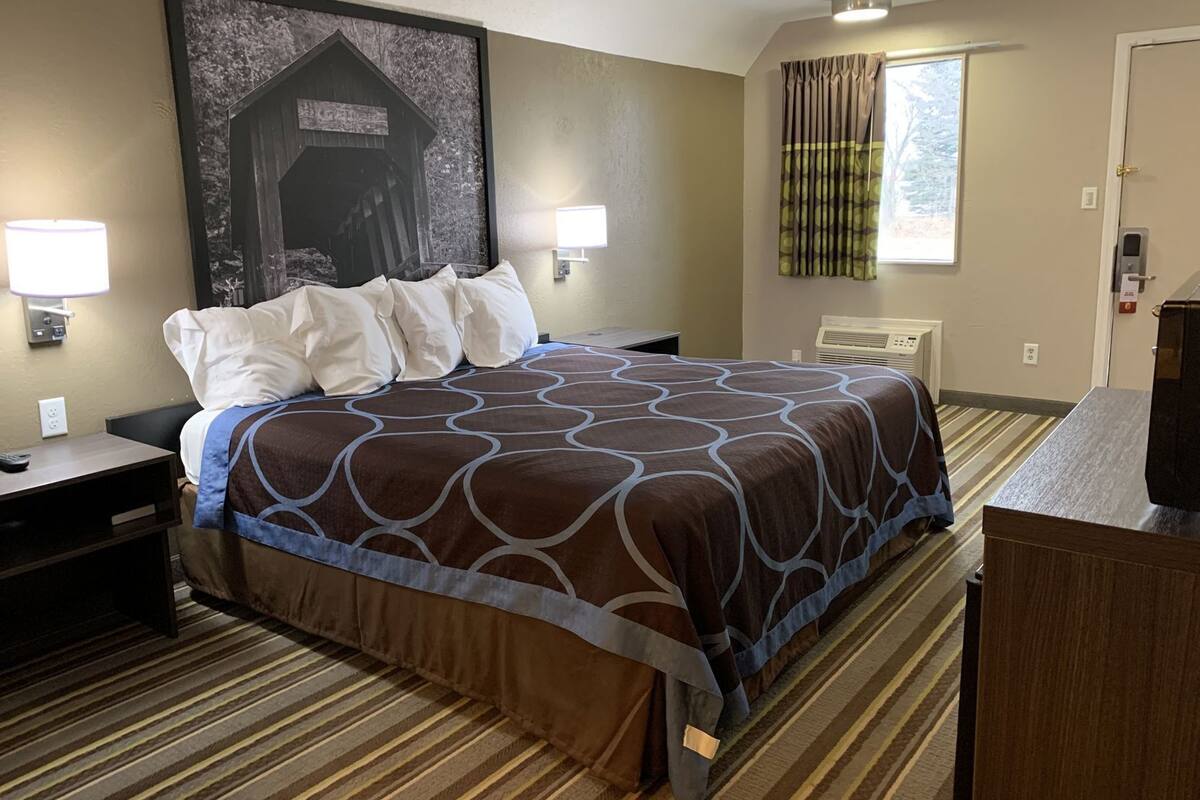 Desk, laptop workspace, blackout drapes, iron/ironing board