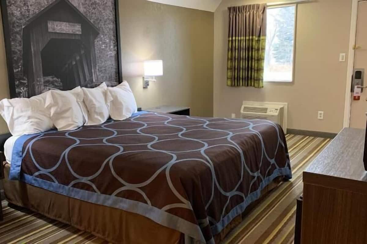 Desk, laptop workspace, blackout drapes, iron/ironing board