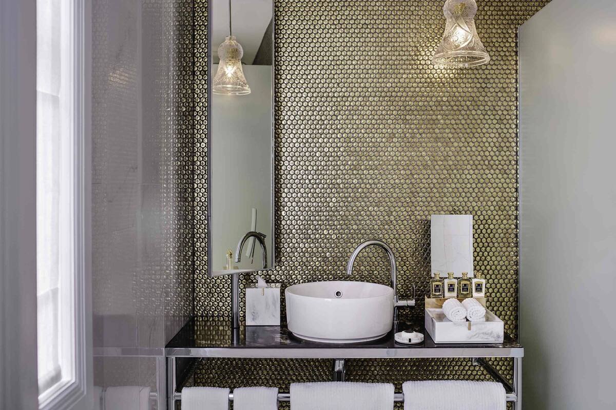 Designer toiletries, hair dryer, bathrobes, slippers
