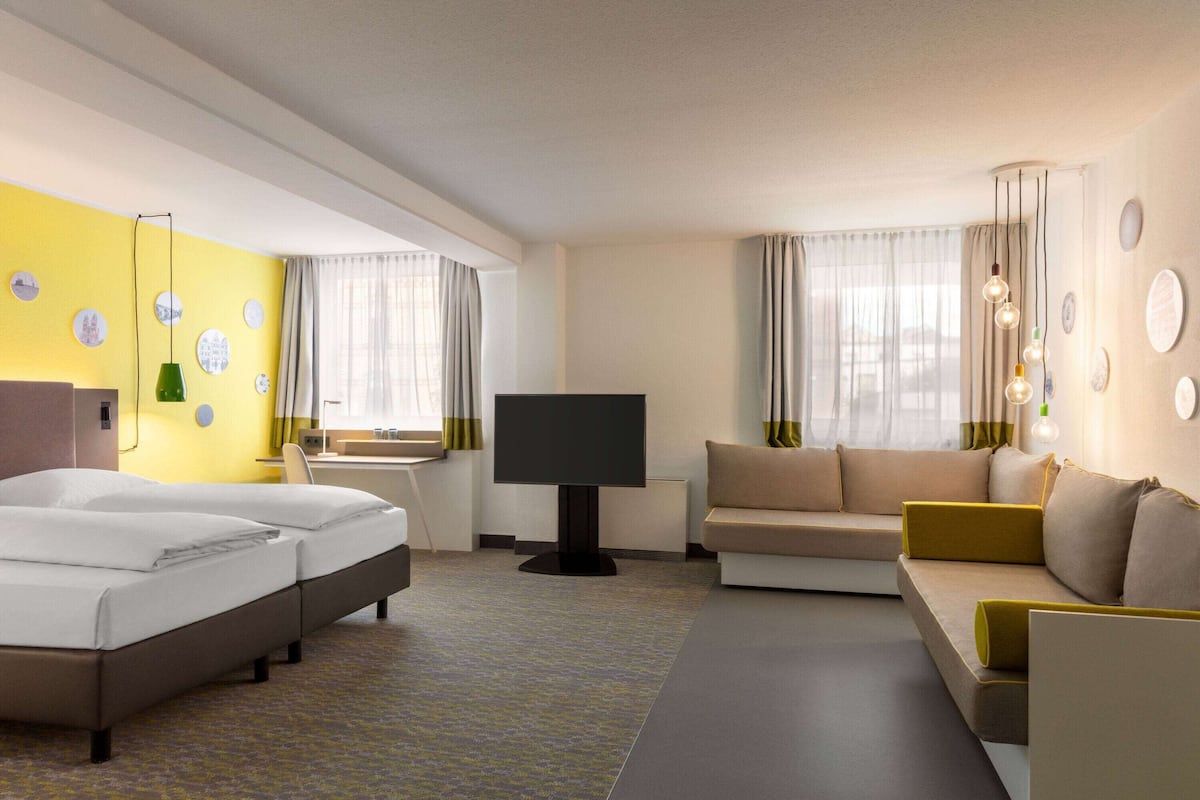 family room | premium bedding, desk, blackout curtains, soundproofing