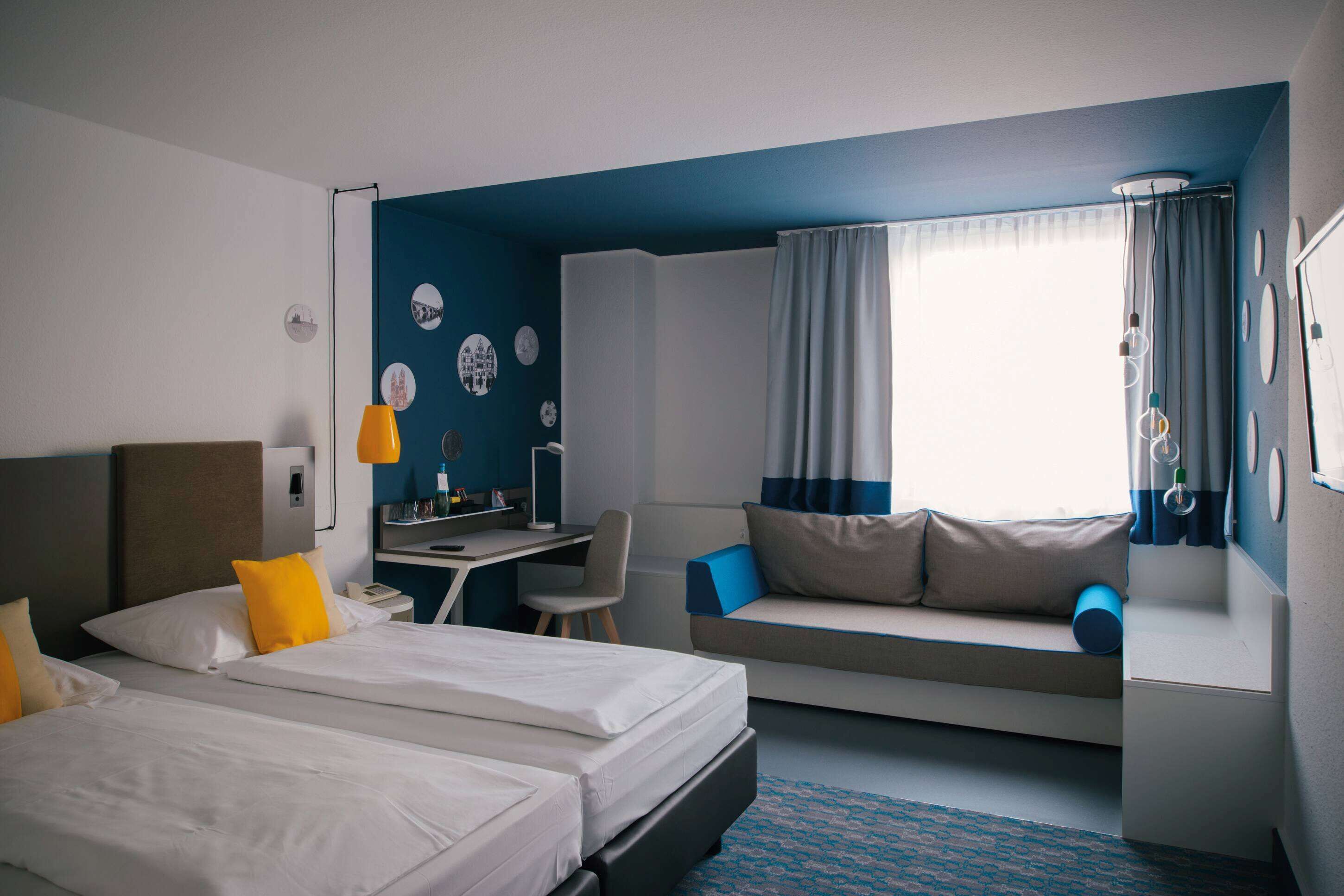 room (lounge) | premium bedding, desk, blackout curtains, soundproofing