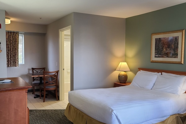 Premium bedding, Tempur-Pedic beds, desk, laptop workspace