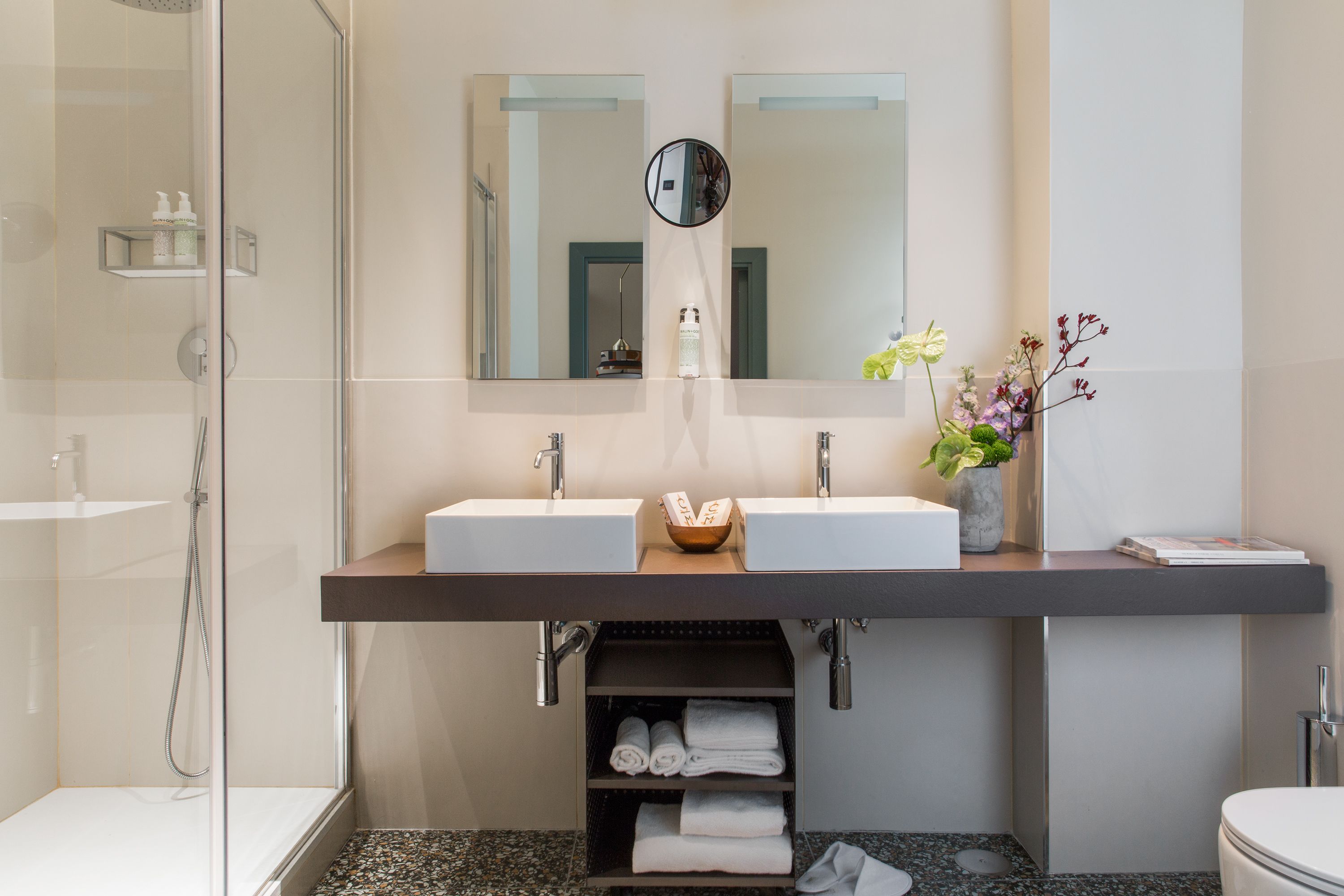 shower, eco-friendly toiletries, slippers, towels