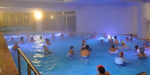 An indoor swimming pool with multiple lanes and people swimming. - Hotel Miramonti (Santo Stefano in Aspromonte)