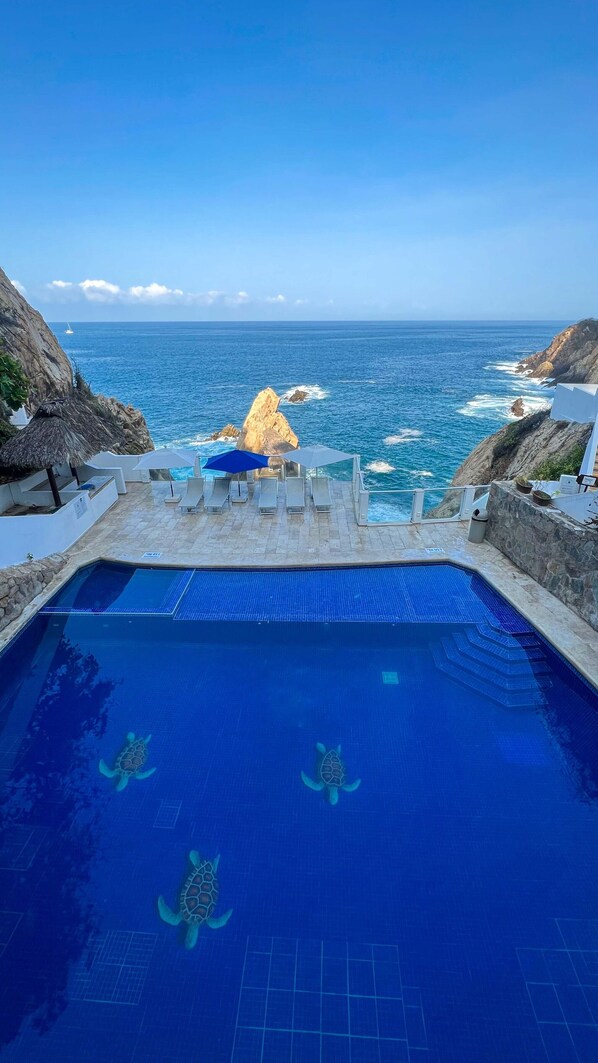 3 outdoor pools, open 8:00 AM to 8 PM, pool umbrellas, pool loungers