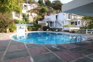 3 outdoor pools, open 8:00 AM to 8 PM, pool umbrellas, pool loungers