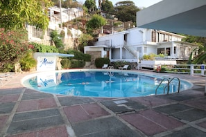 3 outdoor pools, open 8:00 AM to 8 PM, pool umbrellas, pool loungers