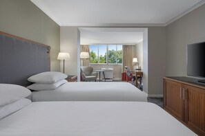 A hotel room with a large bed, a TV, a desk with a chair, and a window with curtains. - Delta Hotels by Marriott Edinburgh (Edinburgh)