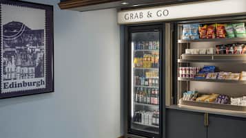 A vending machine labeled "GRAB & GO" with various snacks and beverages.