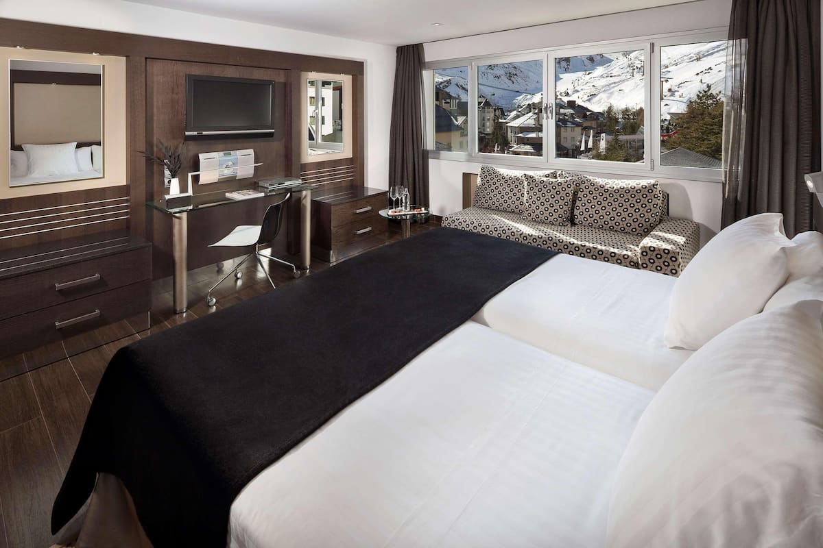 Down comforters, memory foam beds, minibar, in-room safe
