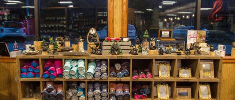 A display of various items including rolled-up clothing, framed pictures, and small figurines.