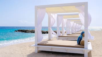 Private beach nearby, white sand, beach towels, beach massages