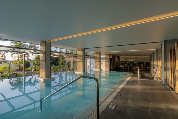 Indoor pool, outdoor pool, open 8 AM to 8 PM, pool umbrellas