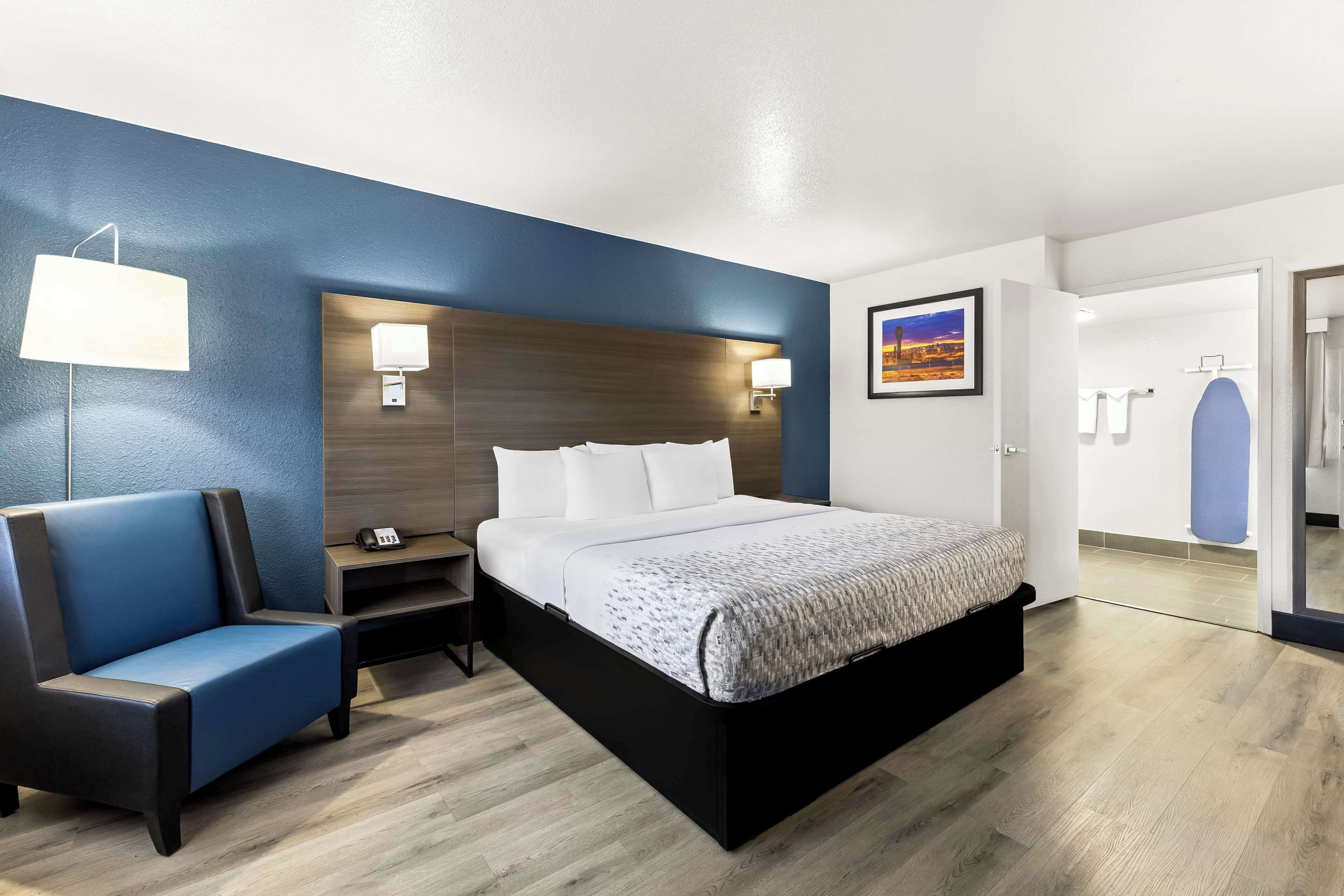 desk, laptop workspace, blackout curtains, iron/ironing board