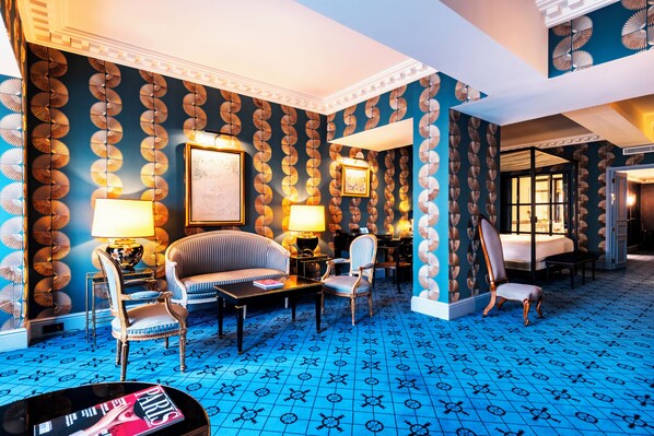 Suite, 1 King Bed with Sofa bed | Premium bedding, minibar, in-room safe, individually decorated